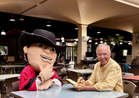 GCC Gaucho being interviewed with John Heckenlaible, GCC PR & Marketing Director.
