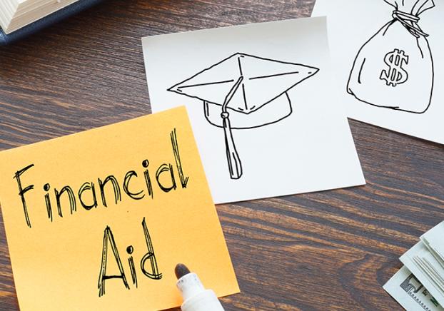 Yellow sticky note with the words, Financial Aid, in black marker.