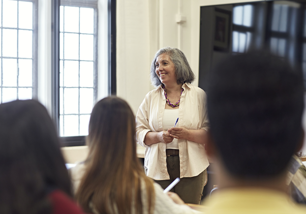 Smiling woman teaching a community ed class